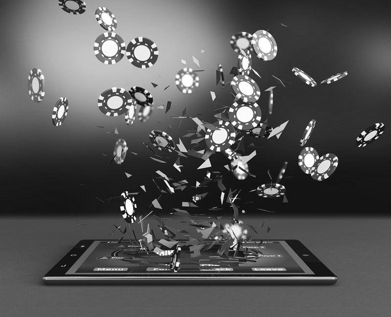 black and white image of poker chips falling on to ipad